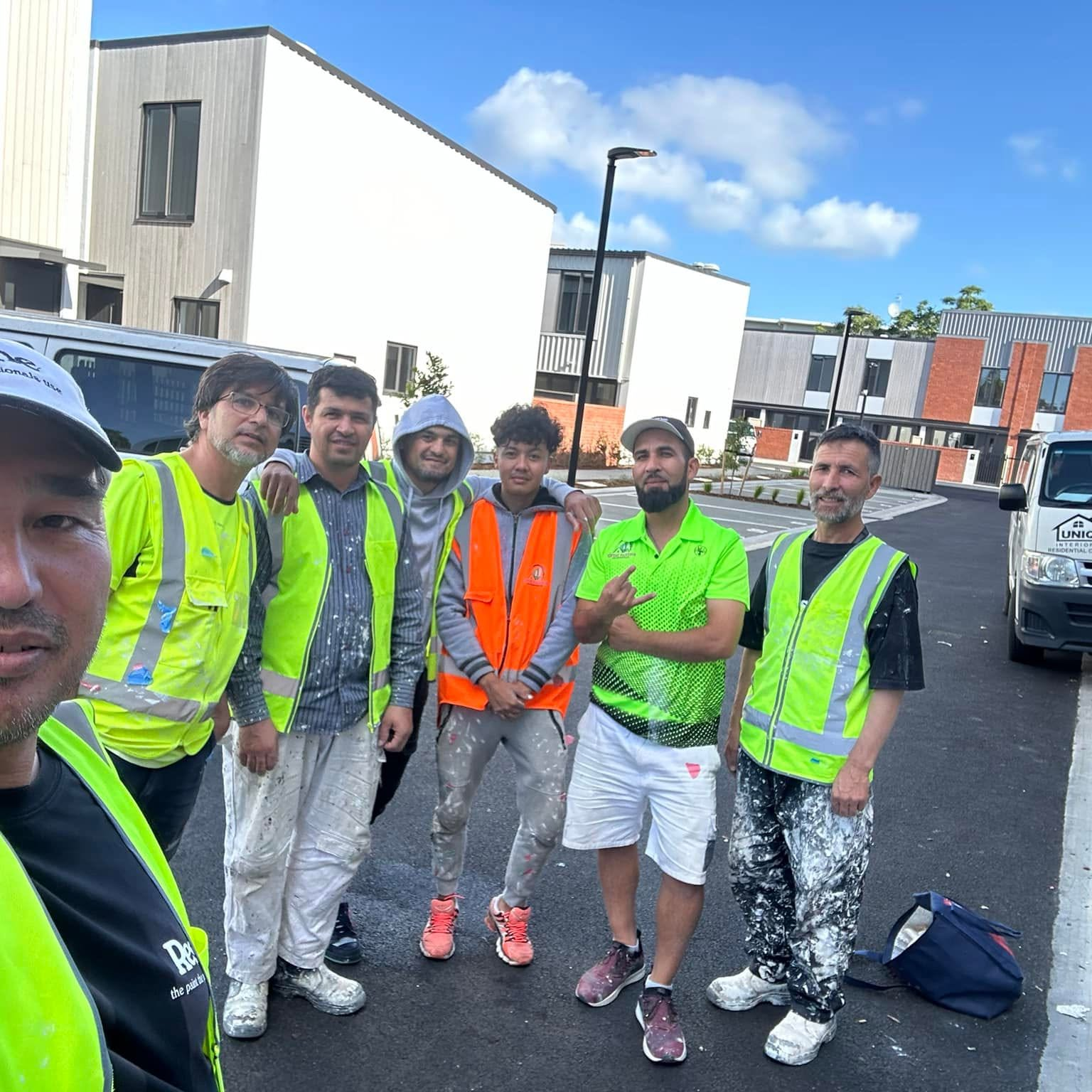 The Rush n Brush crew on site in branded hi-vis on a residential street