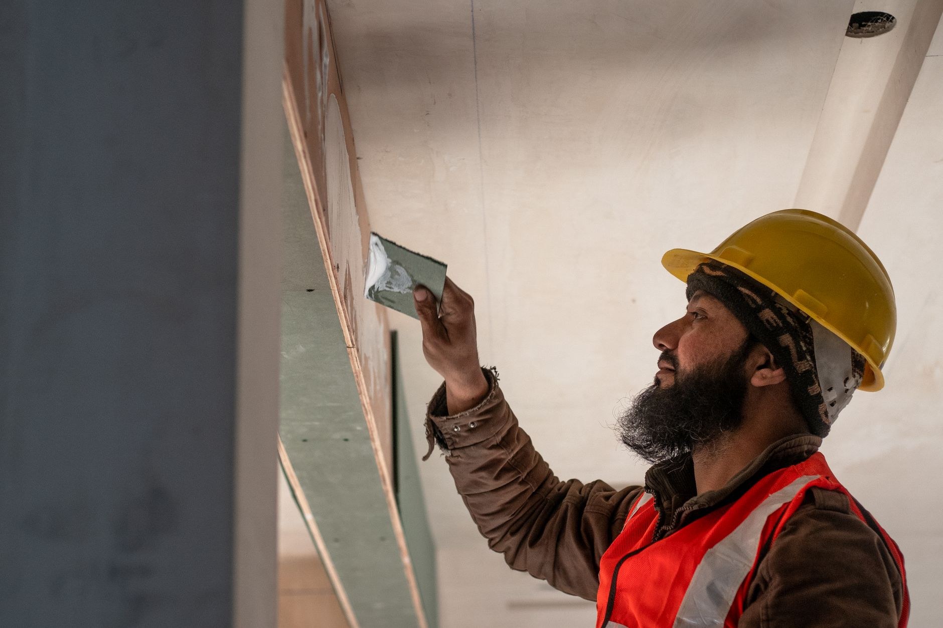 Fresh plaster being worked to a smooth finish